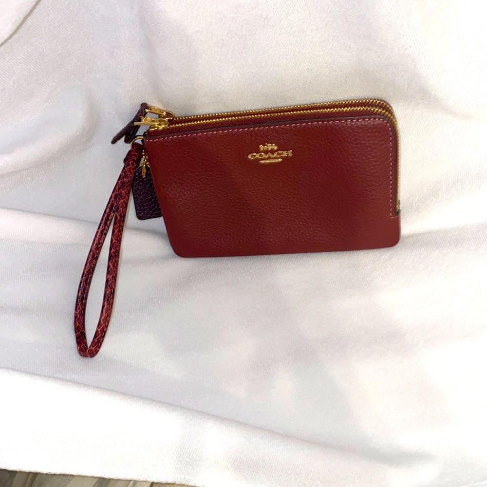 Coach double wristlet. IM/Wine/multi. New/without tag.